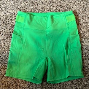 Green Fabletics biker shorts with pockets